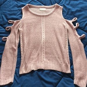 pink and white shoulder-less knit sweater.
